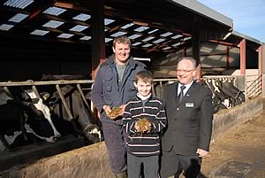 Kevin Wilson, left, with 11 year old son Thomas and NK's Nigel Padbury.