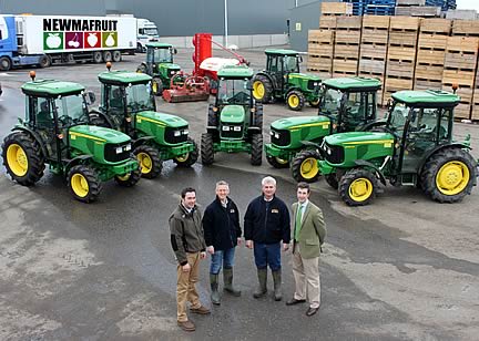 Burden Bros Agri dealer salesman Andy Page, Newmafruit managing director Tony Frankham and farm manager Tim Hall, and John Deere territory manager Paul Burnett, with seven of the new fleet of eight John Deere 5080GF fruit tractors at the Newmafruit headquarters in Kent.